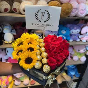 Caja corazon con rosas, girasoles y chocolates Ferrero Rocher.