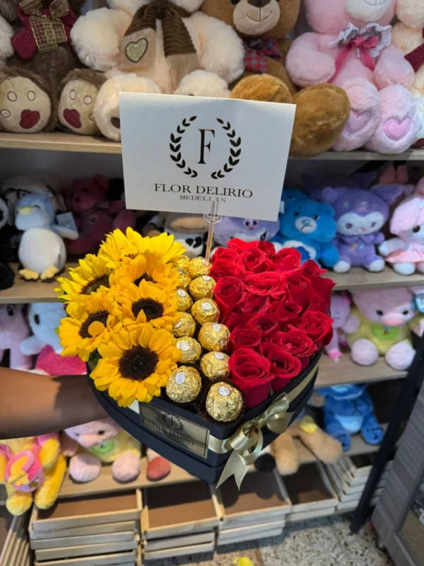 Caja corazon con rosas, girasoles y chocolates Ferrero Rocher.