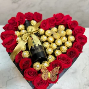 Caja corazon de rosas con chocolates Ferrero Rocher y botella de Bailey's